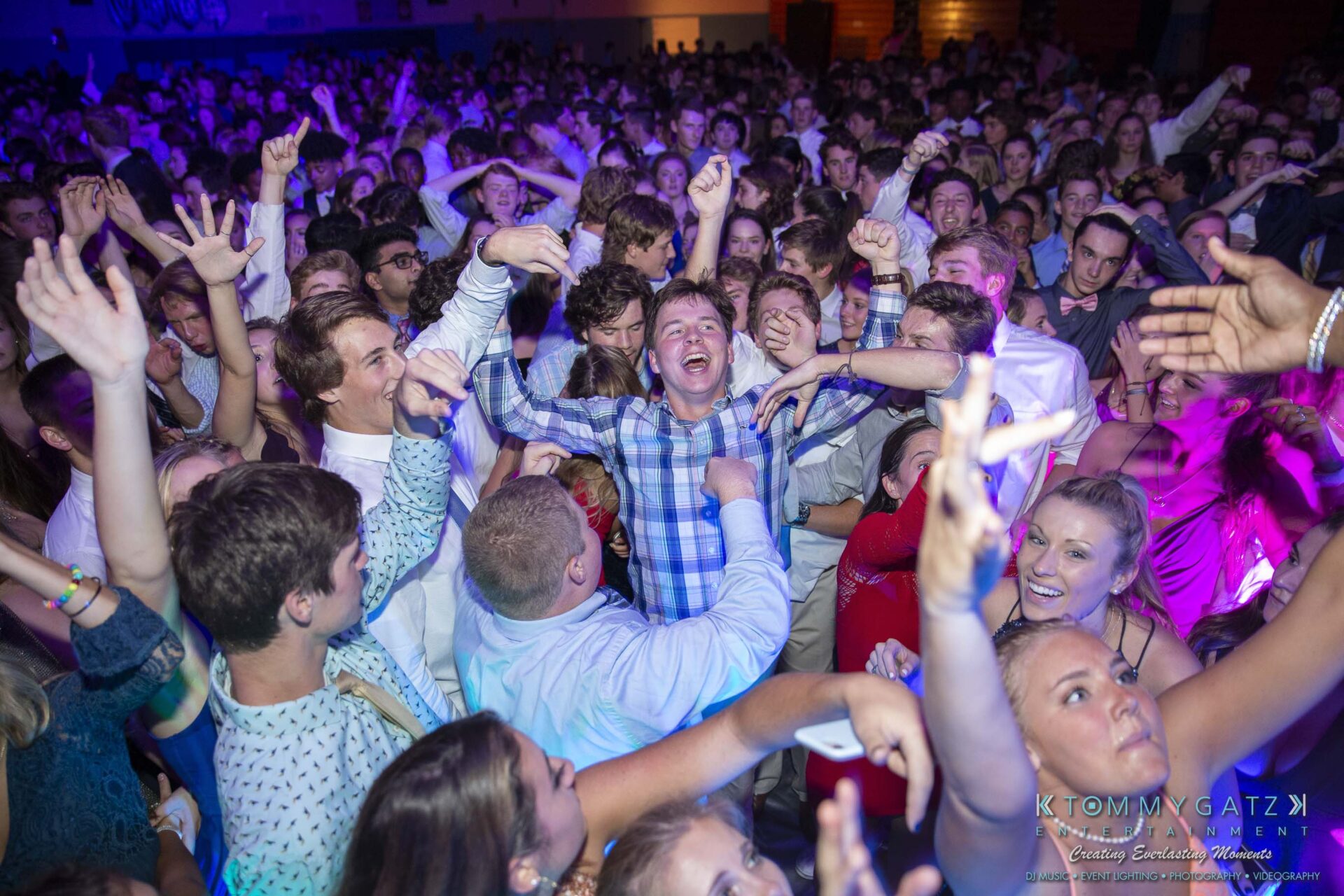 SR-Homecoming-102718-Carl-Low-Res-37 - TOMMY GATZ ENTERTAINMENT A large crowd of people at a lively indoor event, with many smiling, dancing, and enjoying the atmosphere.