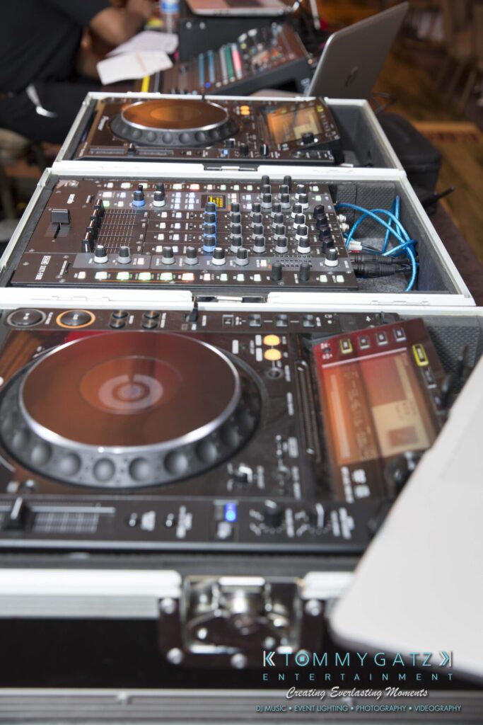 Pillar-Awards-Final-3-24-17-Blog-WM-28 - TOMMY GATZ ENTERTAINMENT Close-up of DJ equipment, including consoles and mixers, on a table.