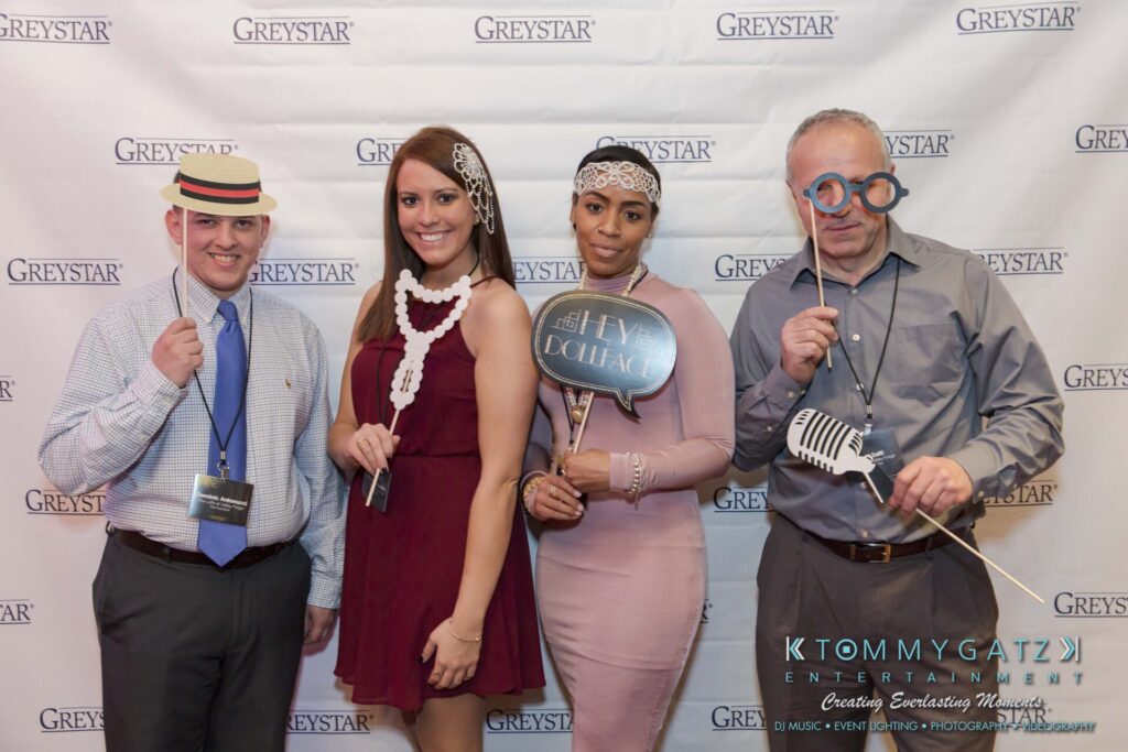 Pillar-Awards-Final-3-24-17-Blog-WM-62 - TOMMY GATZ ENTERTAINMENT Four people posing with props in front of a Greystar backdrop.
