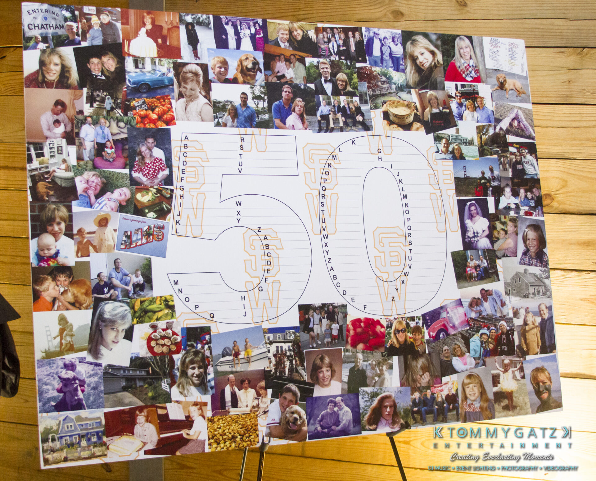 SUSAN_50TH_BIRTHDAY_WATERMARK10 - TOMMY GATZ ENTERTAINMENT A collage featuring numerous small photos surrounding the large number 50, placed on a wooden surface, with a Tommy Gatz Entertainment logo in the bottom right corner.