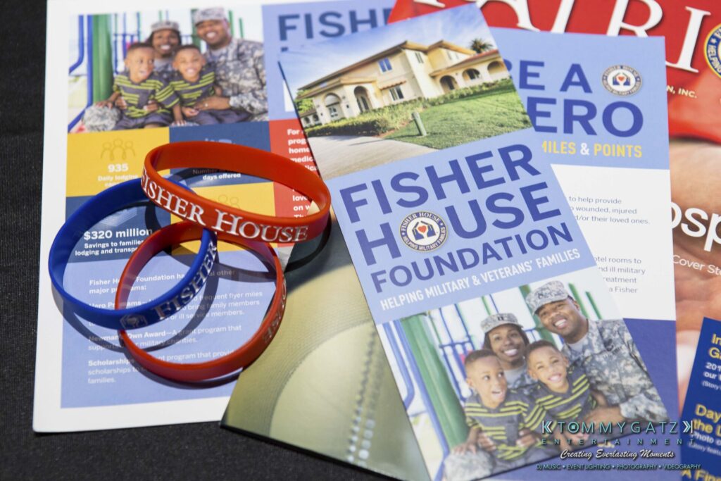 18A0095 - TOMMY GATZ ENTERTAINMENT Fisher House Foundation brochures and wristbands on a table, highlighting support for military and veterans' families.