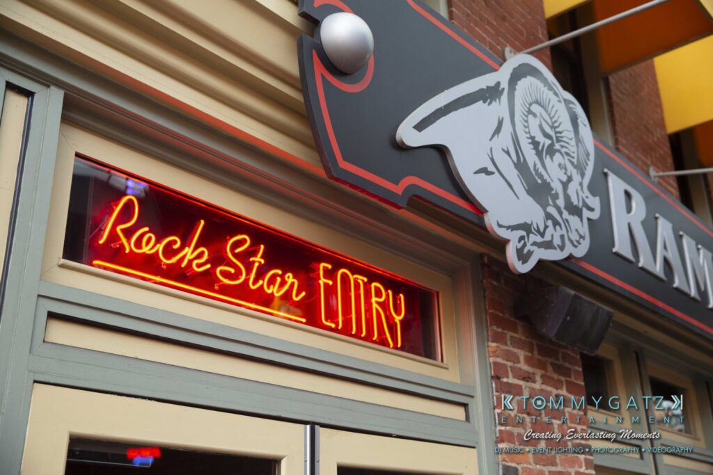 LWYD-Comedy-Tour-Baltimore-060118-FINALS-Low-Res-Watermark-55 - TOMMY GATZ ENTERTAINMENT Neon sign reading "Rock Star Eatry" on a building exterior with a ram logo above.