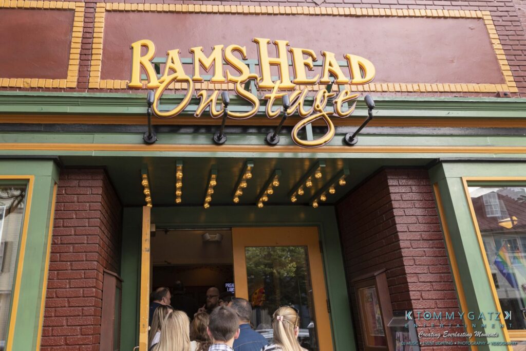 061519-Annapolis-RAMSHEAD-Low-Res-WM-33 - TOMMY GATZ ENTERTAINMENT People entering Rams Head On Stage venue with illuminated sign above entrance.