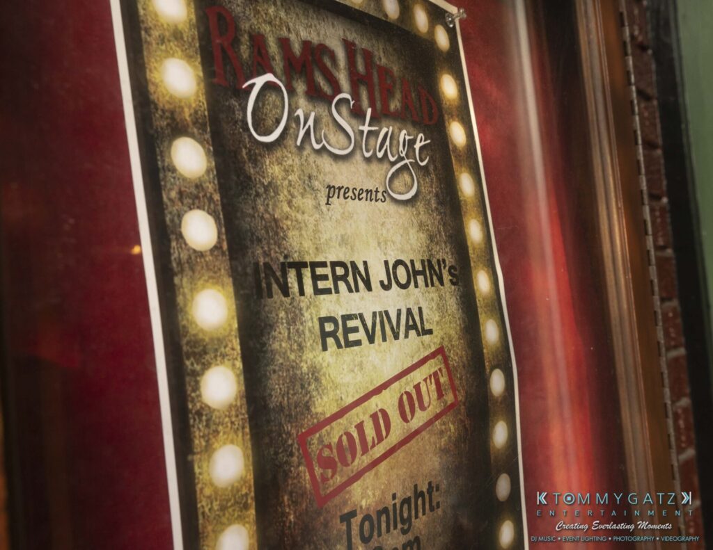 061519-Annapolis-RAMSHEAD-Low-Res-WM-36 - TOMMY GATZ ENTERTAINMENT Close-up of a poster for "Intern John's Revival" at Rams Head OnStage, indicating the show is sold out.