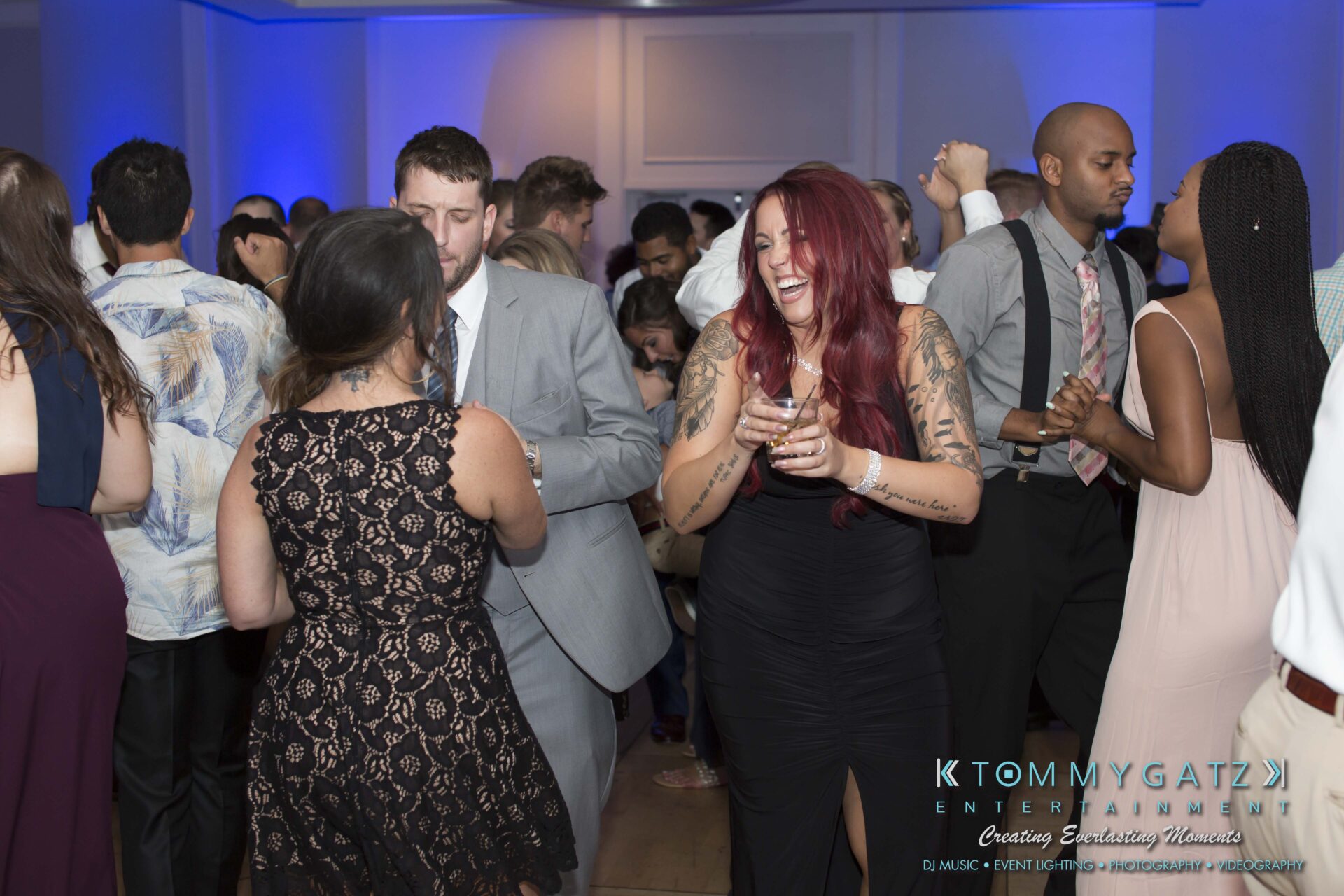 Carly-Patrick-FINAL-Blog-Watermark-47 - TOMMY GATZ ENTERTAINMENT People dancing and socializing at a lively indoor event.