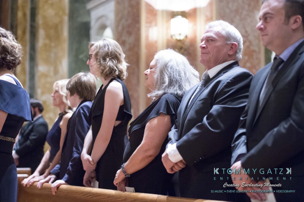 Elizabeth-Tom-101417-CEREMONY-Low-Res-WM-78 - TOMMY GATZ ENTERTAINMENT People standing in a row at an indoor event, wearing formal attire.