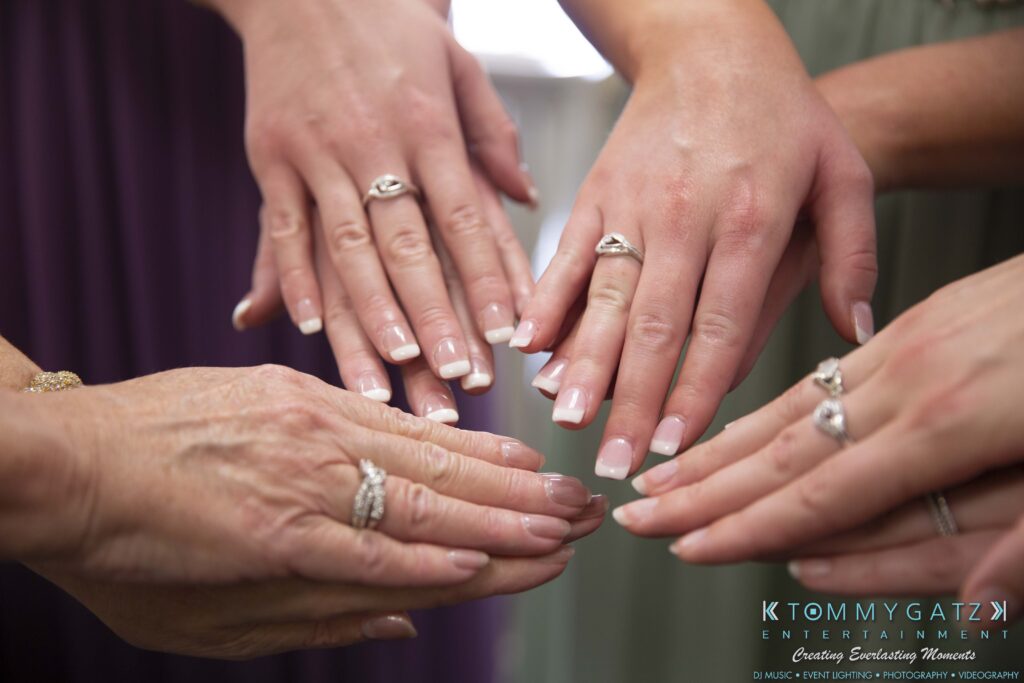 Grace-Michael-063018-PREP-Low-Res-WM-51 - TOMMY GATZ ENTERTAINMENT Six hands with manicured nails showing rings.