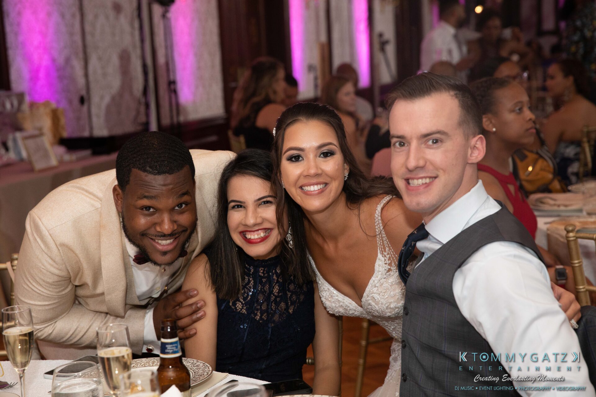 Harris-Wedding-HIGHLIGHTS-090119-100 - TOMMY GATZ ENTERTAINMENT Four people pose together and smile at a formal event.