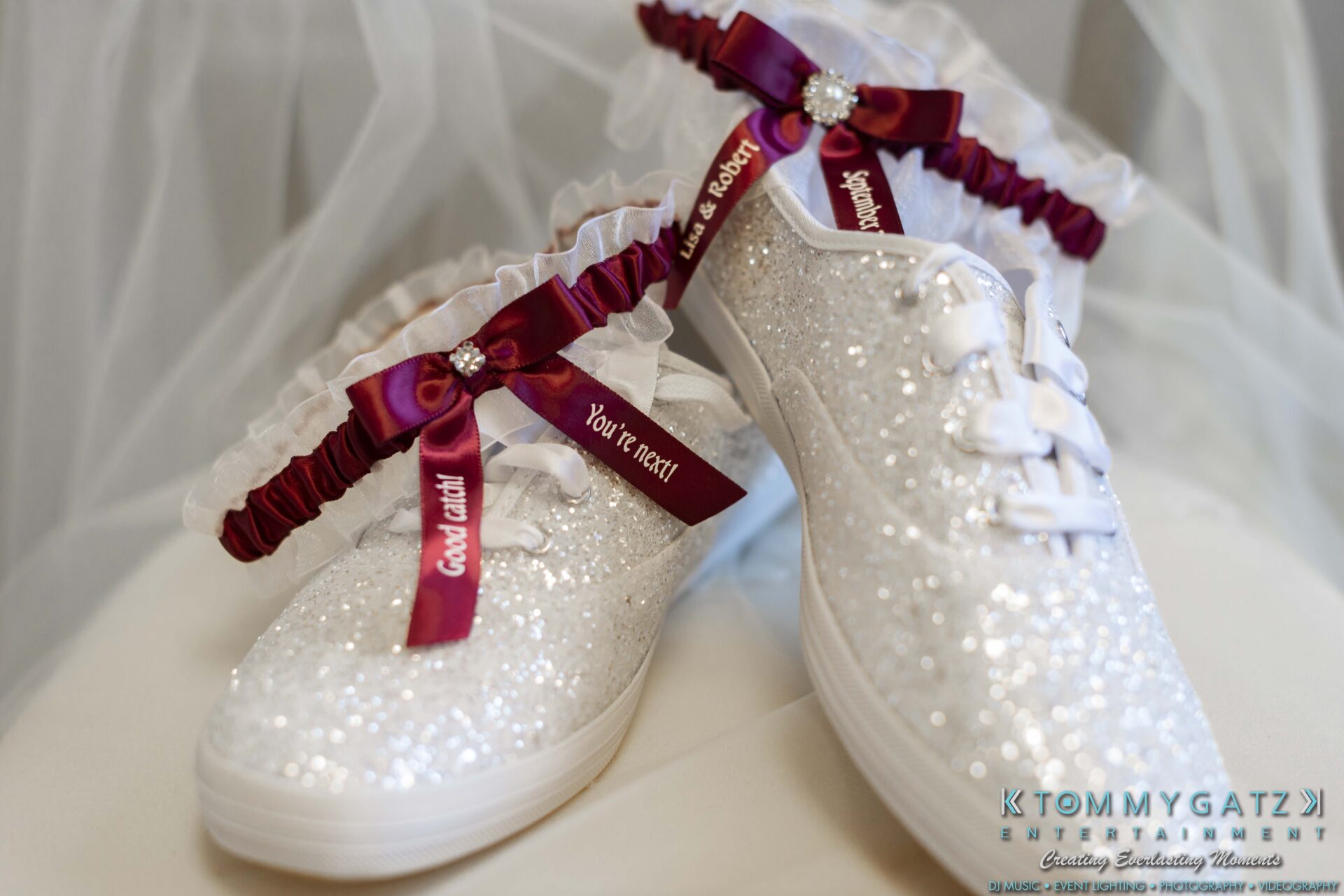 Lisa-Robert-092218-BLOG-selections-WM-2 - TOMMY GATZ ENTERTAINMENT Sparkly white sneakers with lace-up ribbons are adorned with red garters.