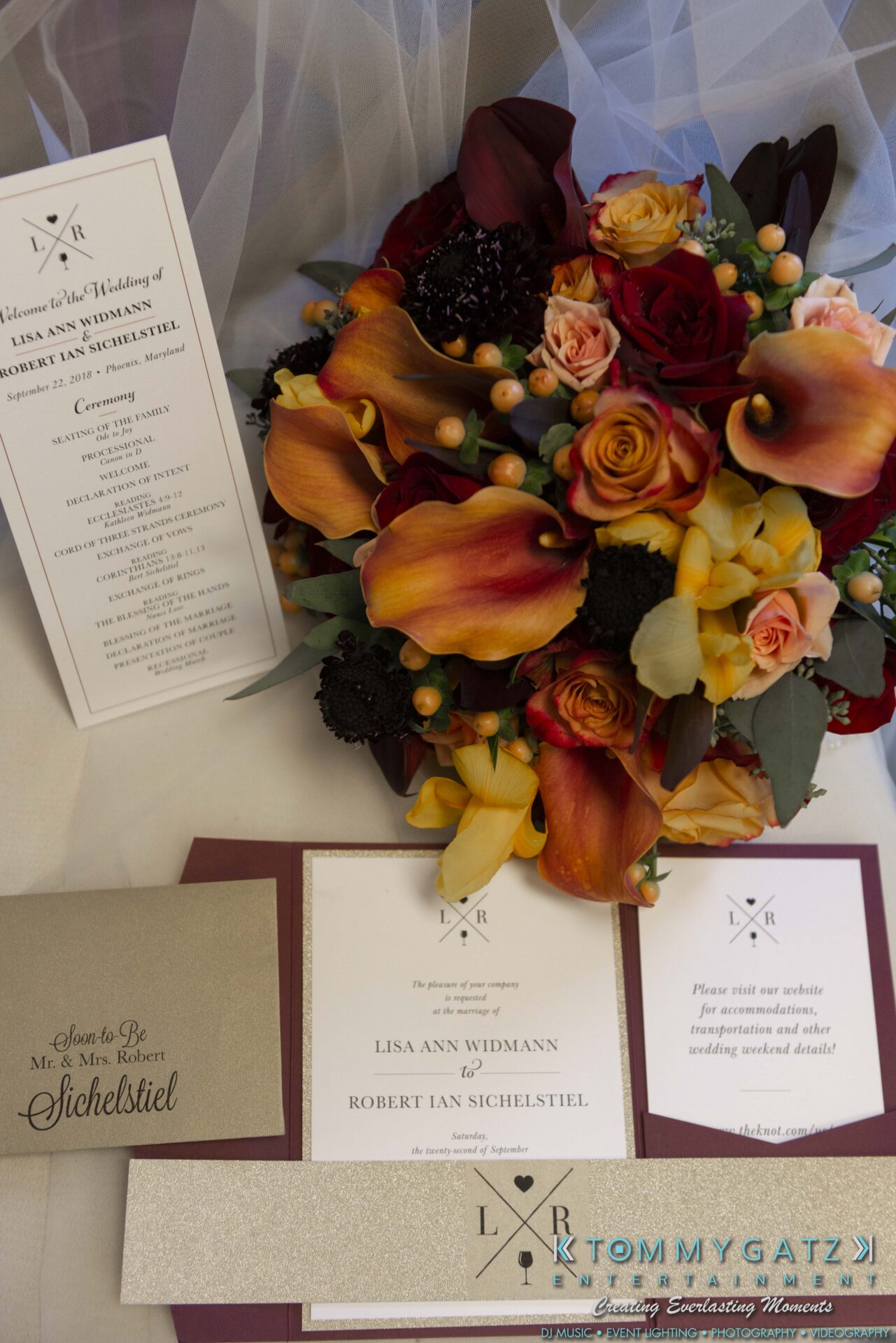 Lisa-Robert-092218-BLOG-selections-WM-5 - TOMMY GATZ ENTERTAINMENT Wedding invitation suite with floral arrangement in red, yellow, and orange. Includes a program, invitation, and RSVP card with gold details.