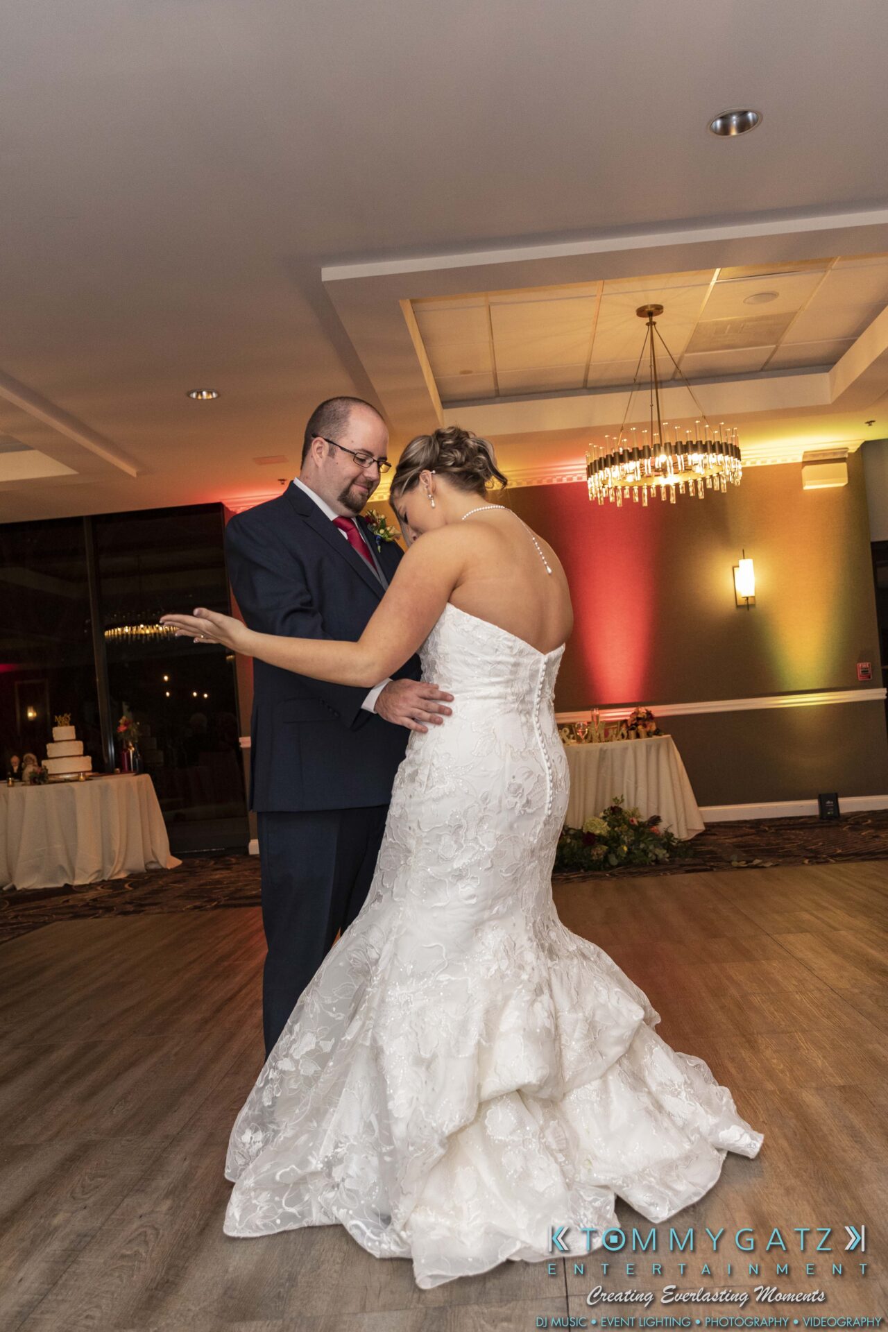 Lisa-Robert-092218-BLOG-selections-WM-90 - TOMMY GATZ ENTERTAINMENT A couple dances in a decorated room, with the woman wearing a white dress and the man in a suit.