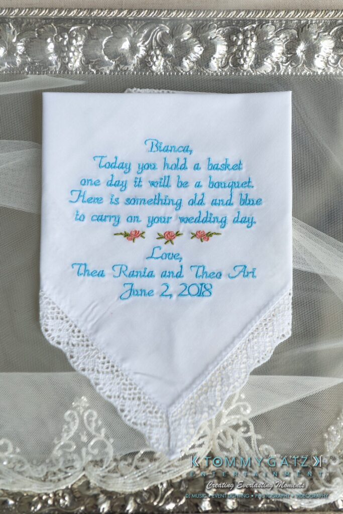 Embroidered handkerchief with lace trim featuring a wedding message and floral design, dated June 2, 2018.