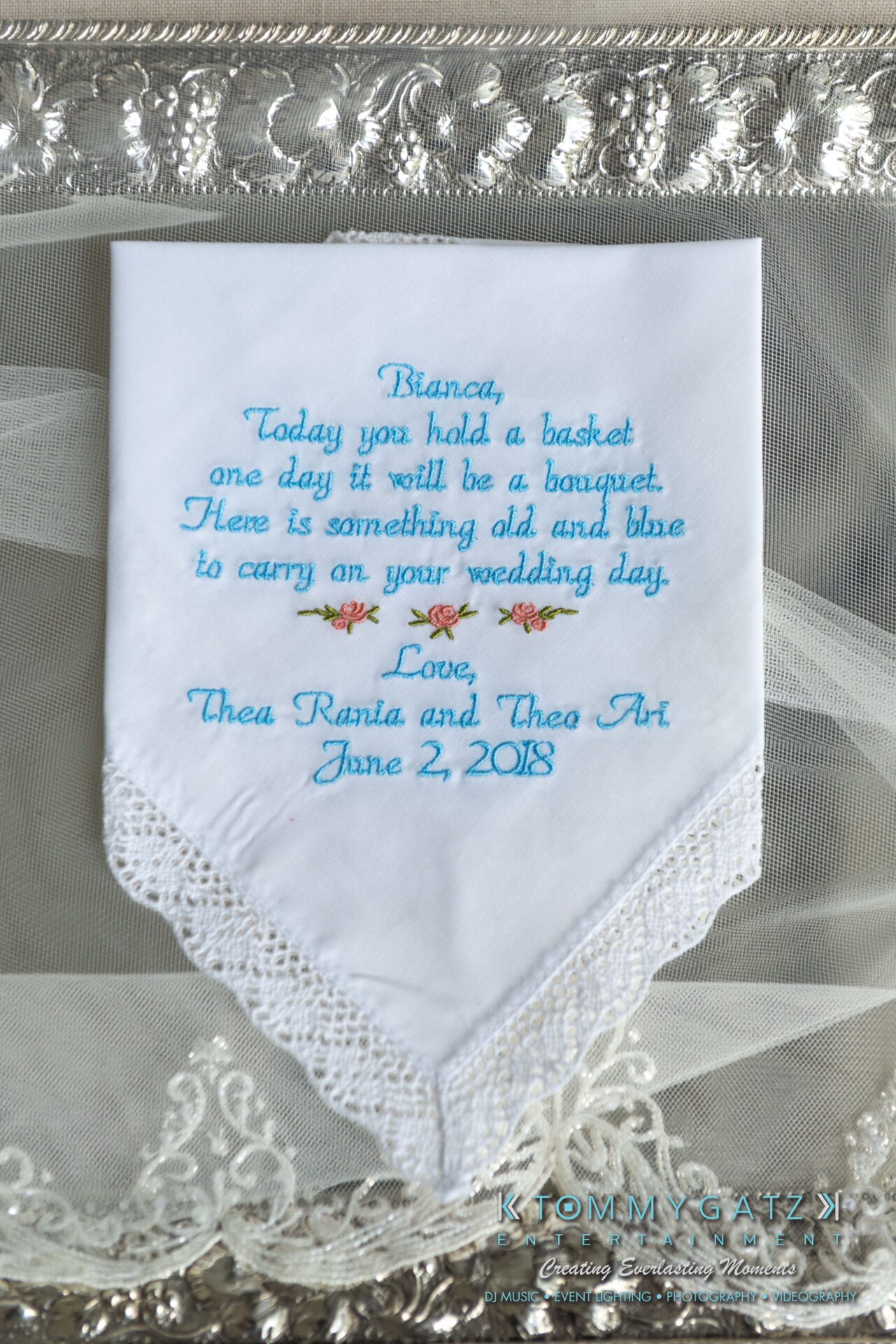 Urania-Aristidis-060218-PREP-Low-Res-WM-25 - TOMMY GATZ ENTERTAINMENT A handkerchief with a lace trim, embroidered with a wedding message, floral details, and the date: June 2, 2018.