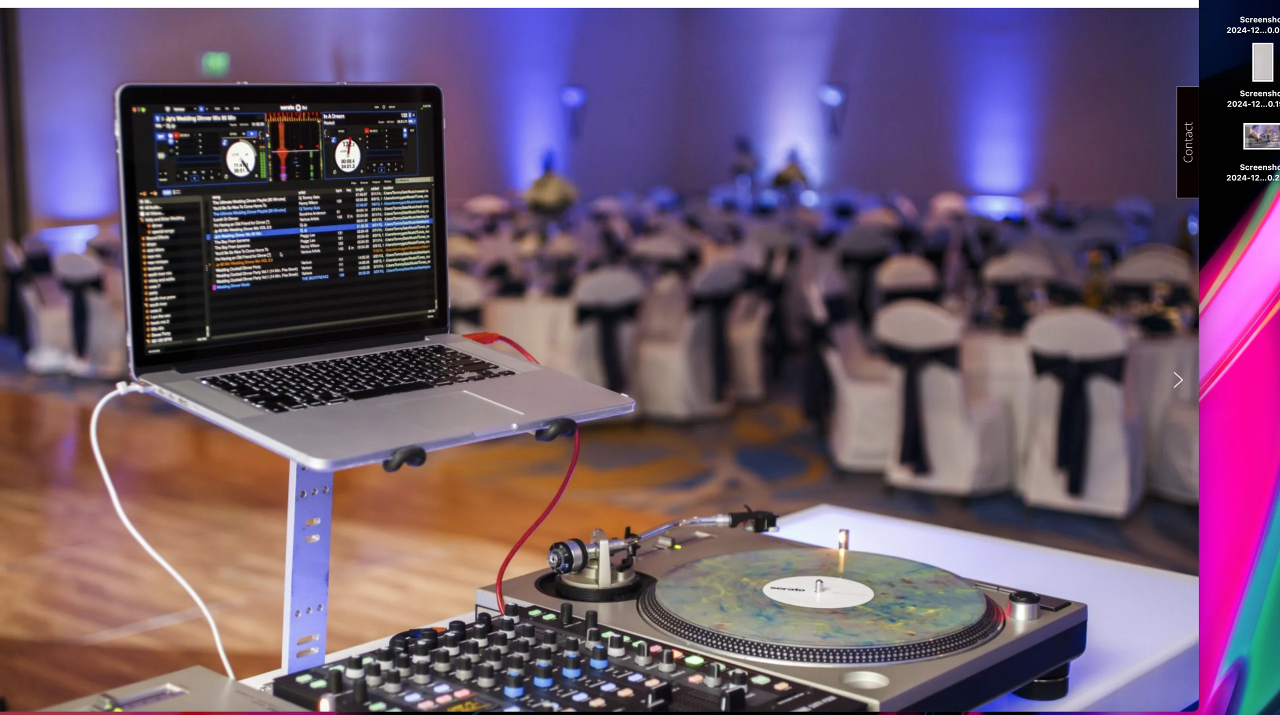 DJ setup with a laptop displaying music software and a turntable. The background shows a blurred event hall with tables and chairs adorned in white and black covers.